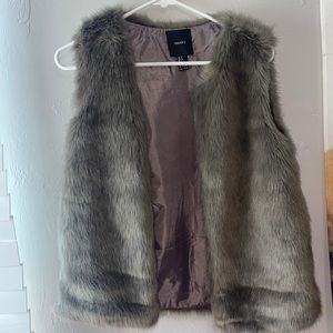 Grey fur vest. Never worn in perfect condition